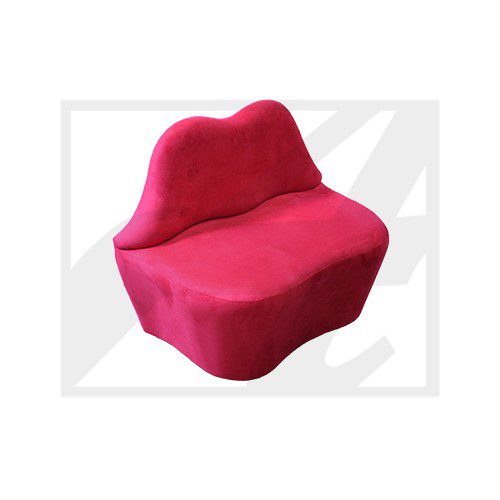 A bright red sofa shaped like lips.