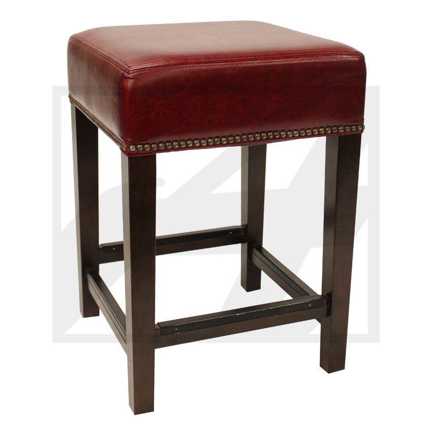 Square red leather stool with dark wooden legs.