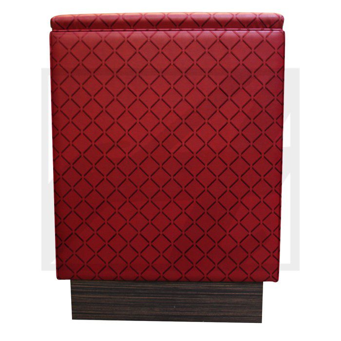 Red patterned table runner with a wooden base.