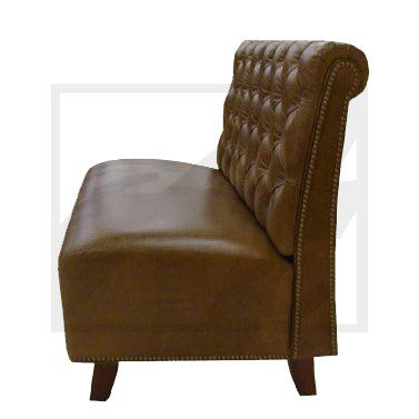 Brown leather tufted sofa with wooden legs and a rolled backrest.