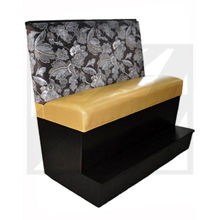 Black and gold upholstered bench with floral backrest.