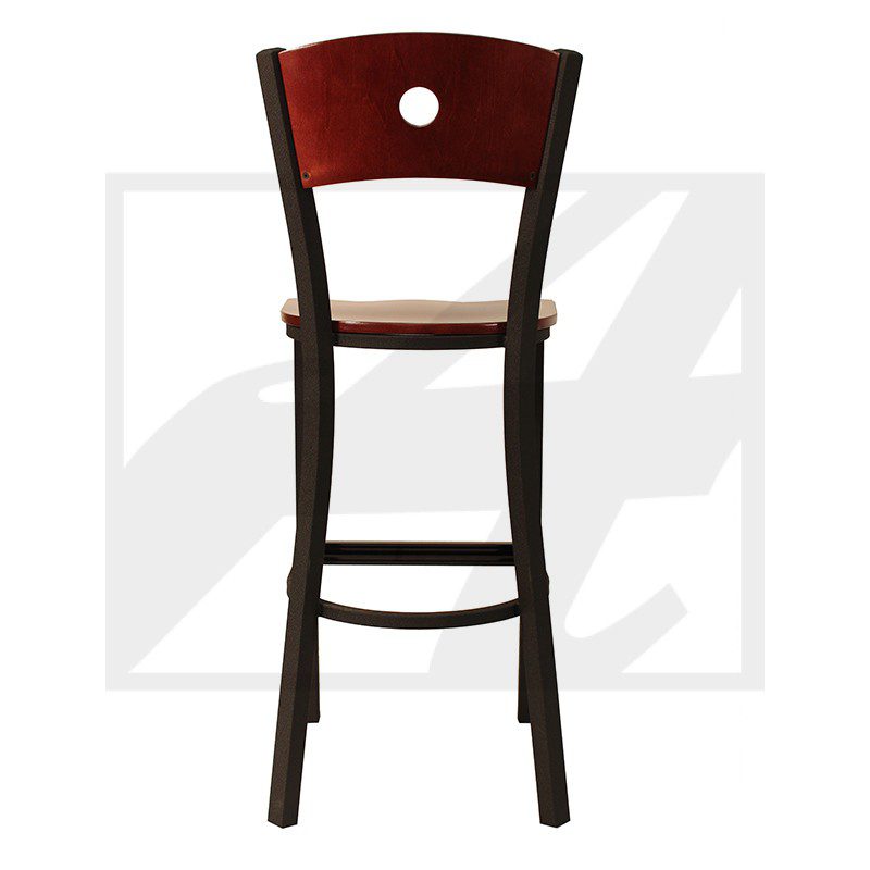 A tall wooden bar stool with a cushioned seat and a hole in the backrest.