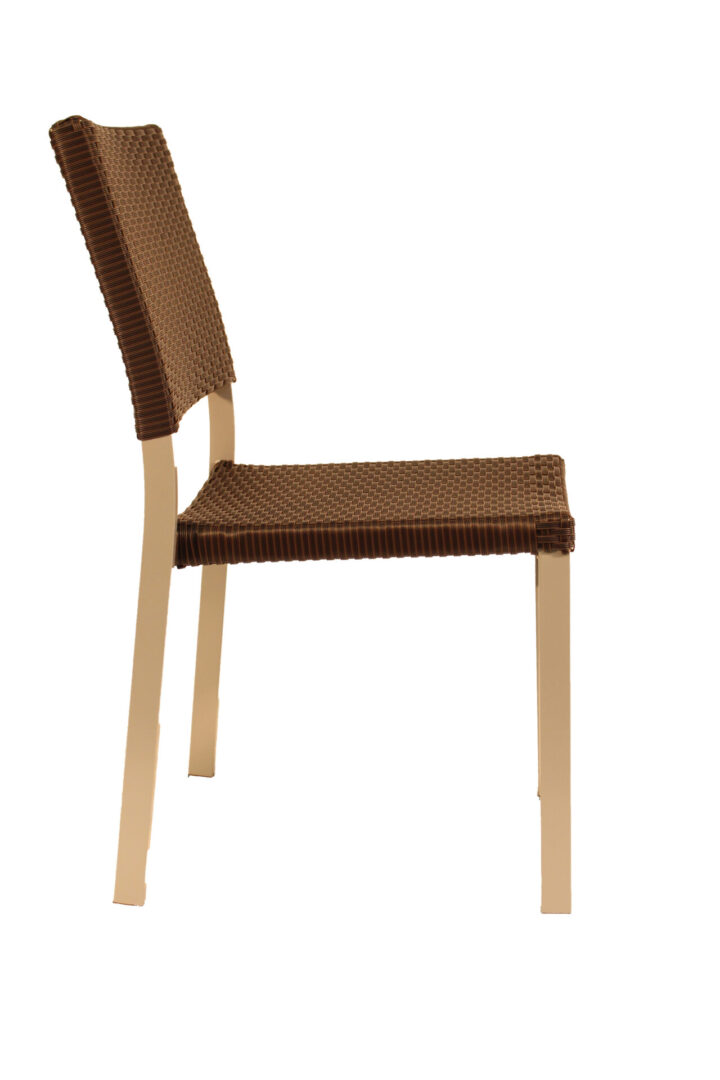 Side view of a wooden chair with a woven seat and backrest.
