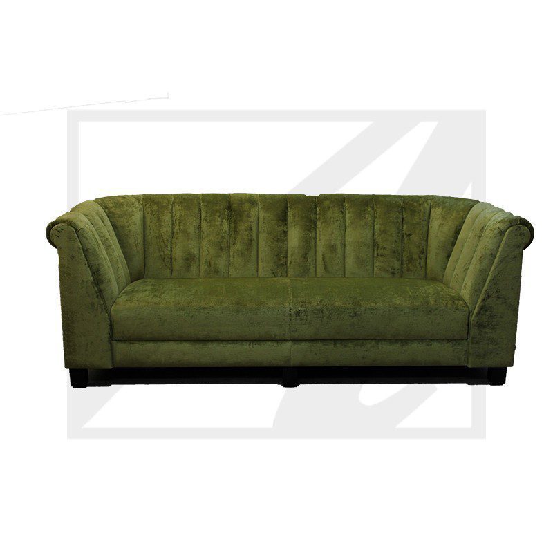 Green velvet sofa with tufted backrest and rounded arms.