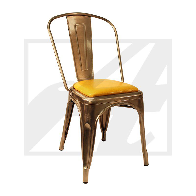 A metallic chair with a yellow cushion and a curved backrest.