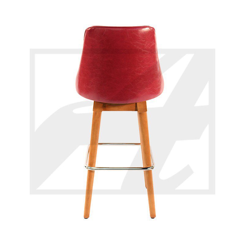 Red cushioned bar stool with wooden legs and footrest.