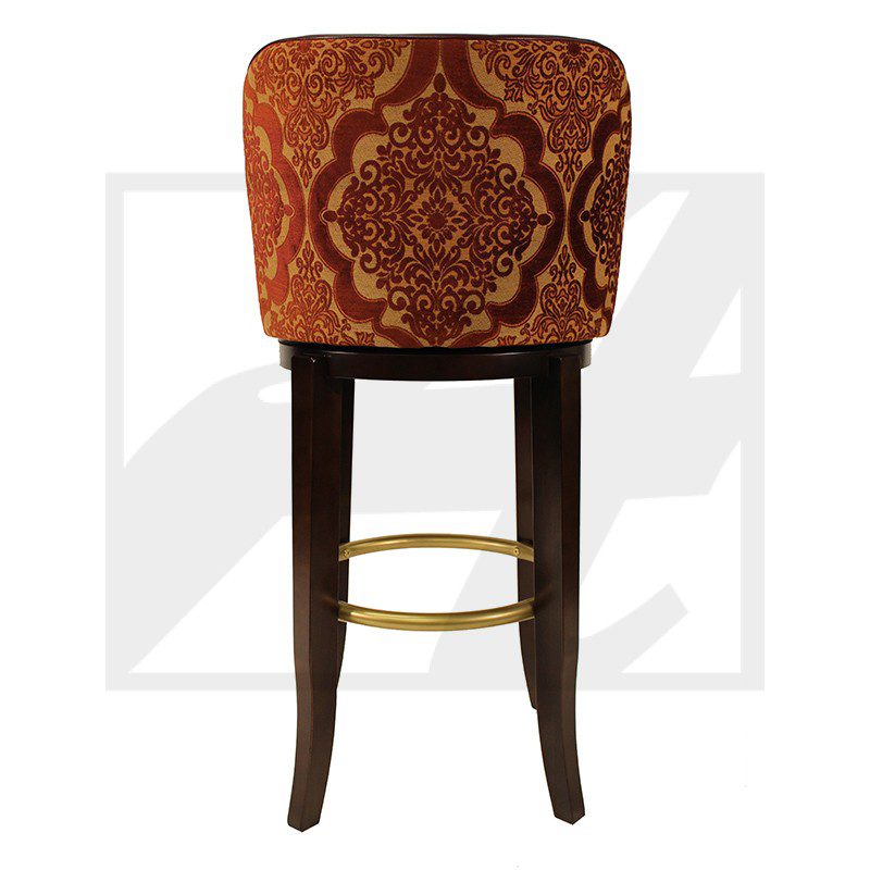 Elegant bar stool with ornate red upholstery and dark wooden legs.