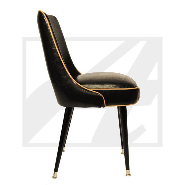 Elegant black velvet chair with gold piping and tapered legs.