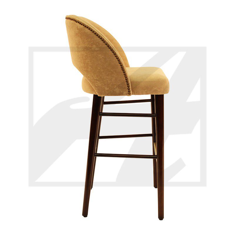 Elegant yellow upholstered bar stool with dark wooden legs.