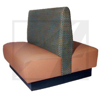 Modern restaurant booth seating with leather cushions and textured backrest.