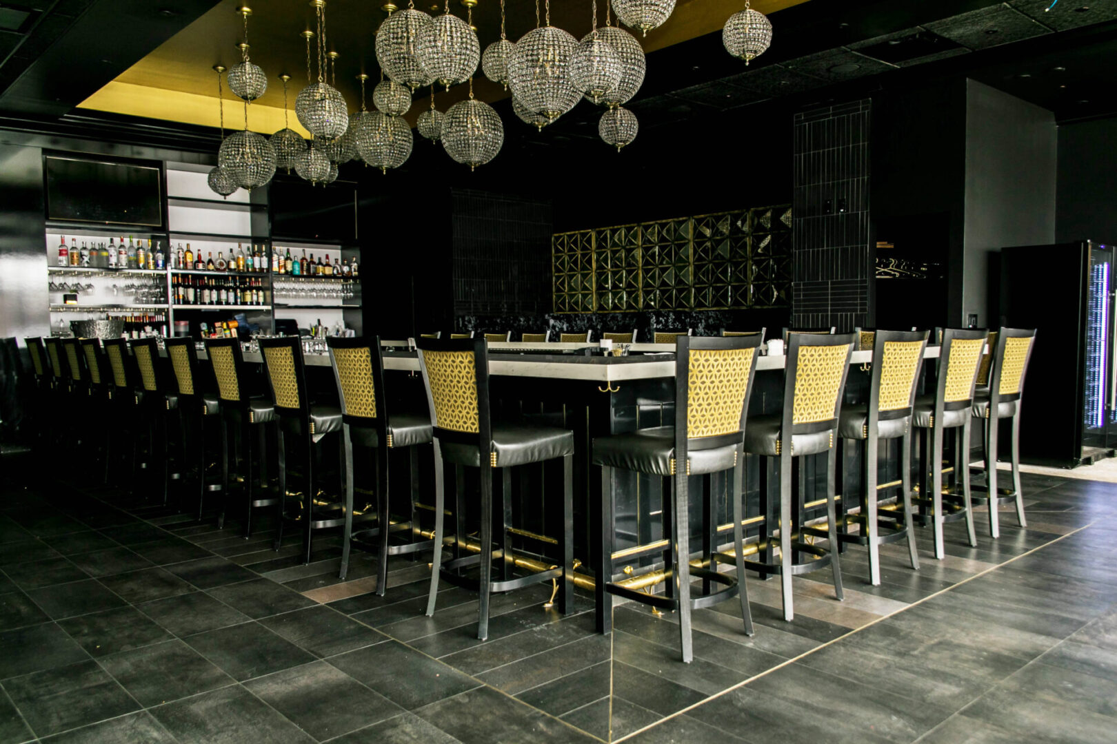 Elegant bar with modern seating and ambient lighting.