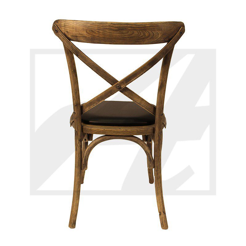 Wooden cross-back chair with cushioned seat.