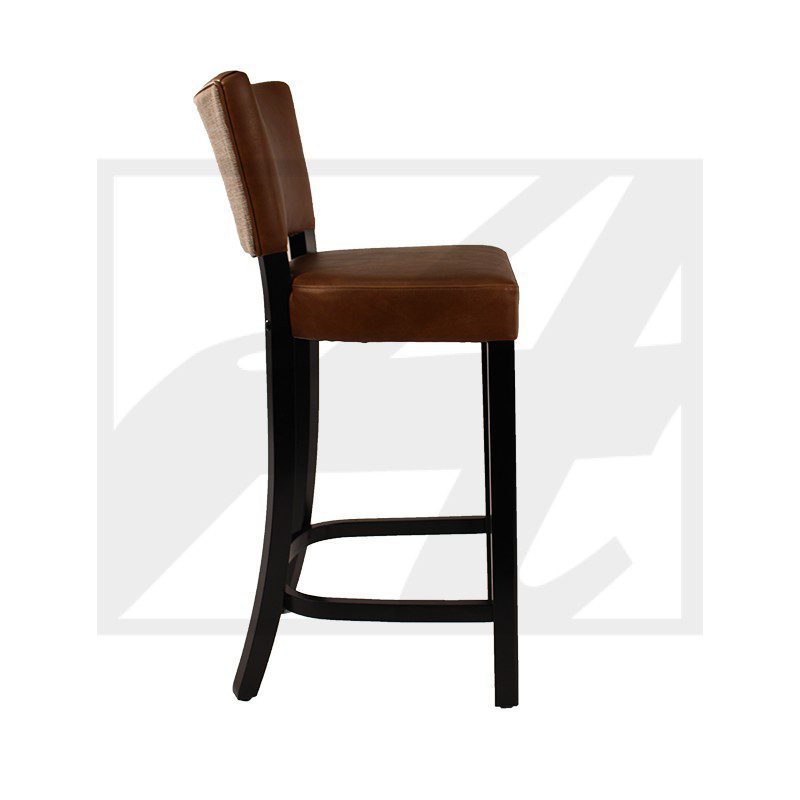 Side view of a brown cushioned bar stool with dark wooden legs.