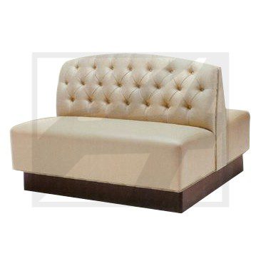 Beige tufted booth seating with wooden base.