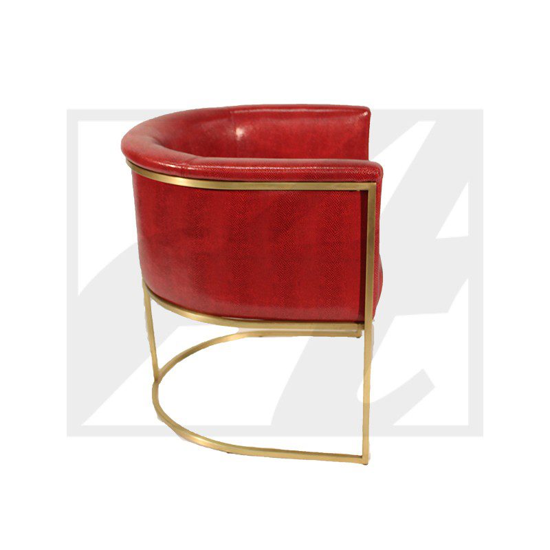 Modern red velvet chair with gold metal frame and curved design.