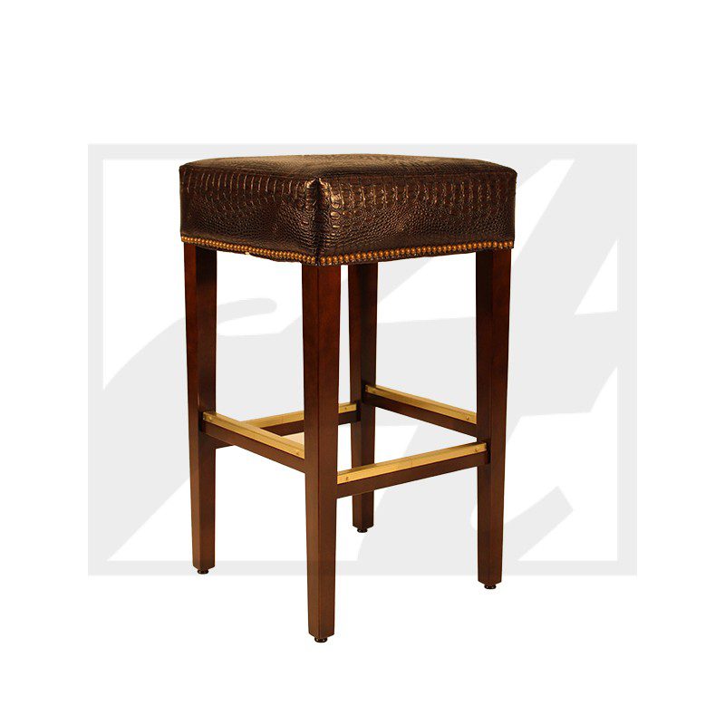 Brown leather bar stool with wooden legs and brass footrest.