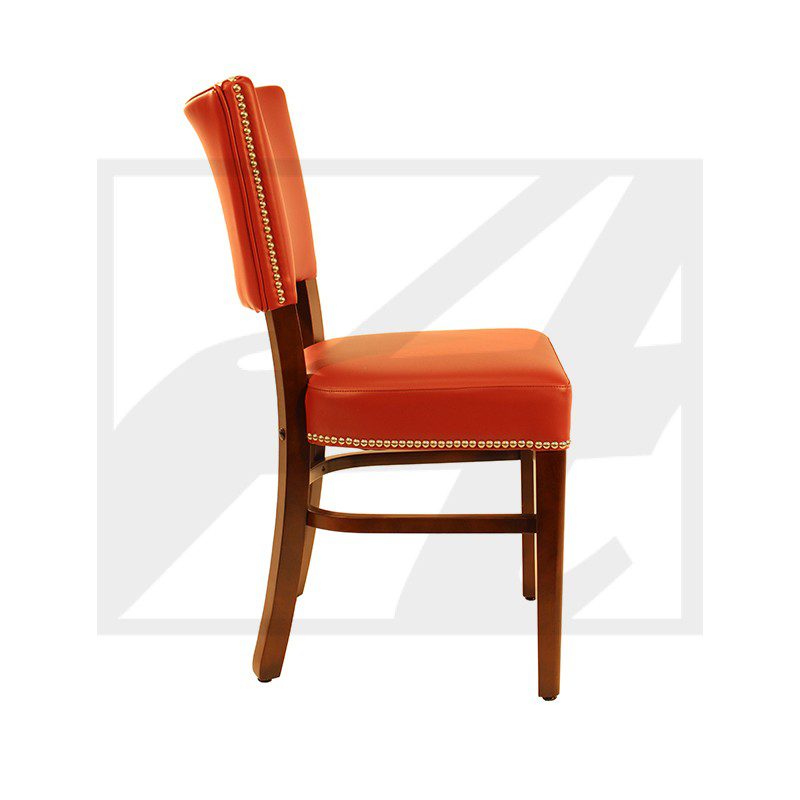 Side view of an orange upholstered wooden chair.