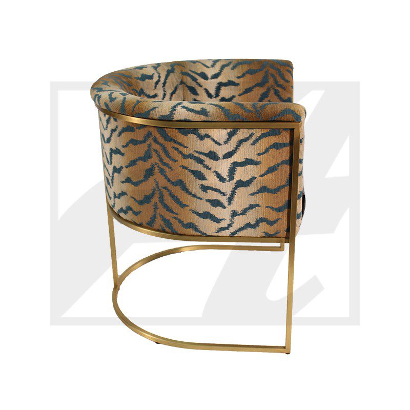 Modern tiger-patterned chair with gold metal frame.
