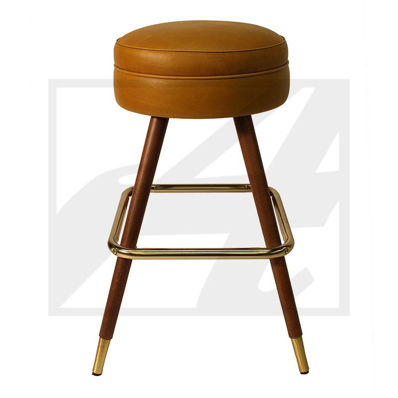 Modern brown leather bar stool with wooden legs and brass footrest.